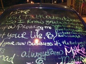 The message on the beer-throwing woman's car.